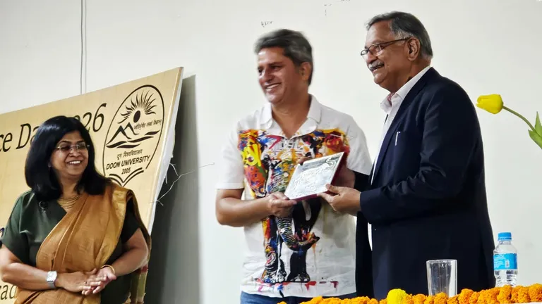 A speaker honoured at Gaja Utsav, Doon University