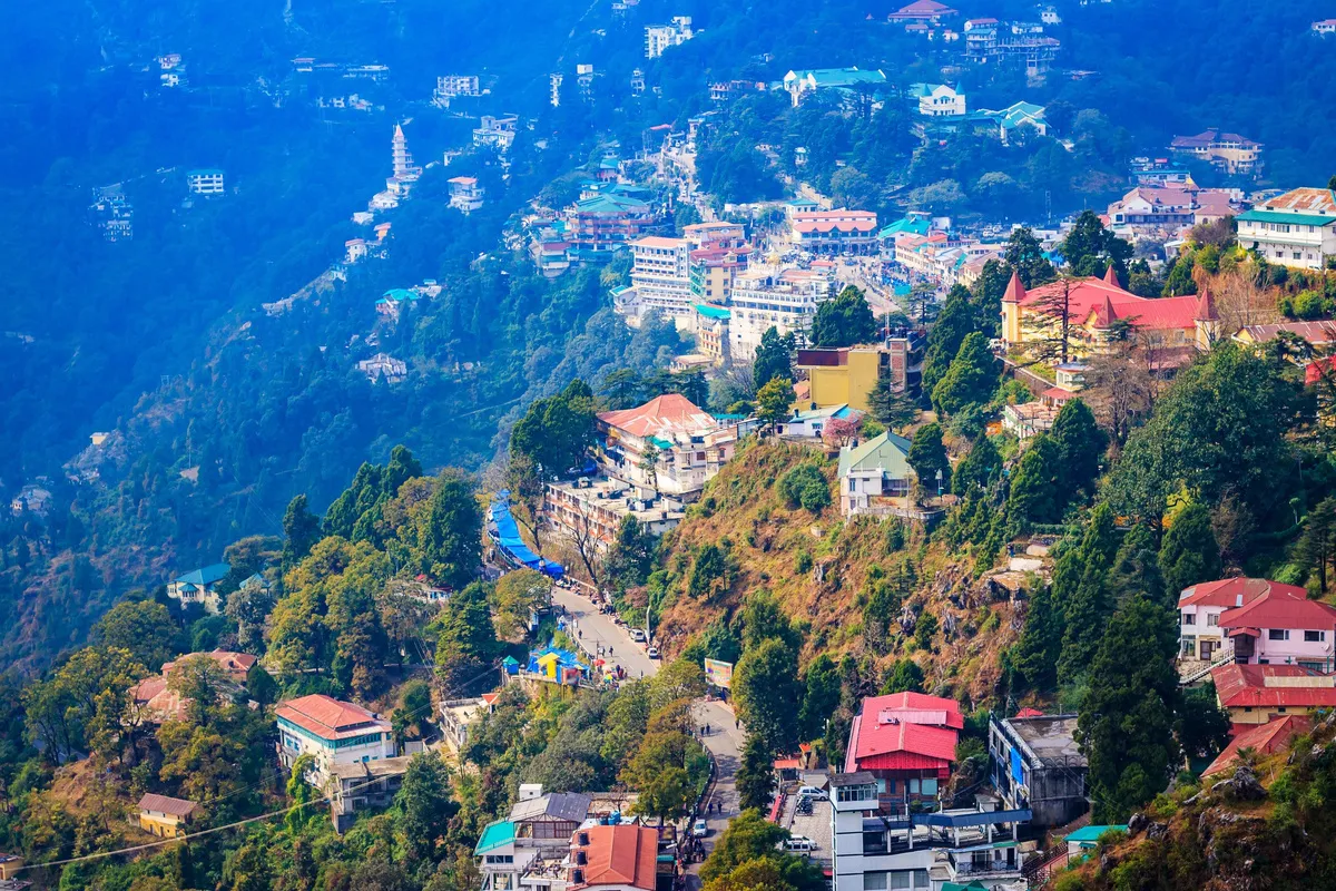 Mussoorie spread along its ridge above a forested valley