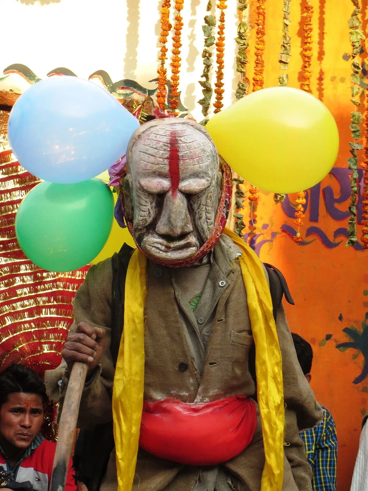 The painted wooden mask of Latu Devta at the mask festival in Lata village