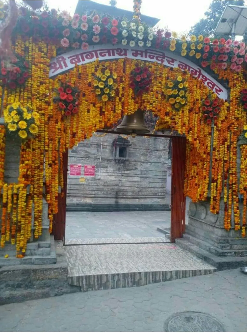 The gate of the Bagnath temple in Bageshwar hung with marigold garlands for Uttarayani