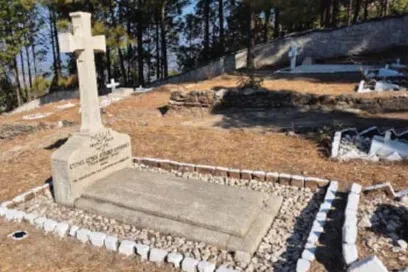 A grave at the Lansdowne Cemetery after its restoration, re-edged with stone and brick