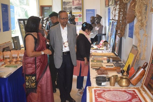 Visitors at the Uttarakhand Museum Community exhibition, among copper vessels and ringal baskets